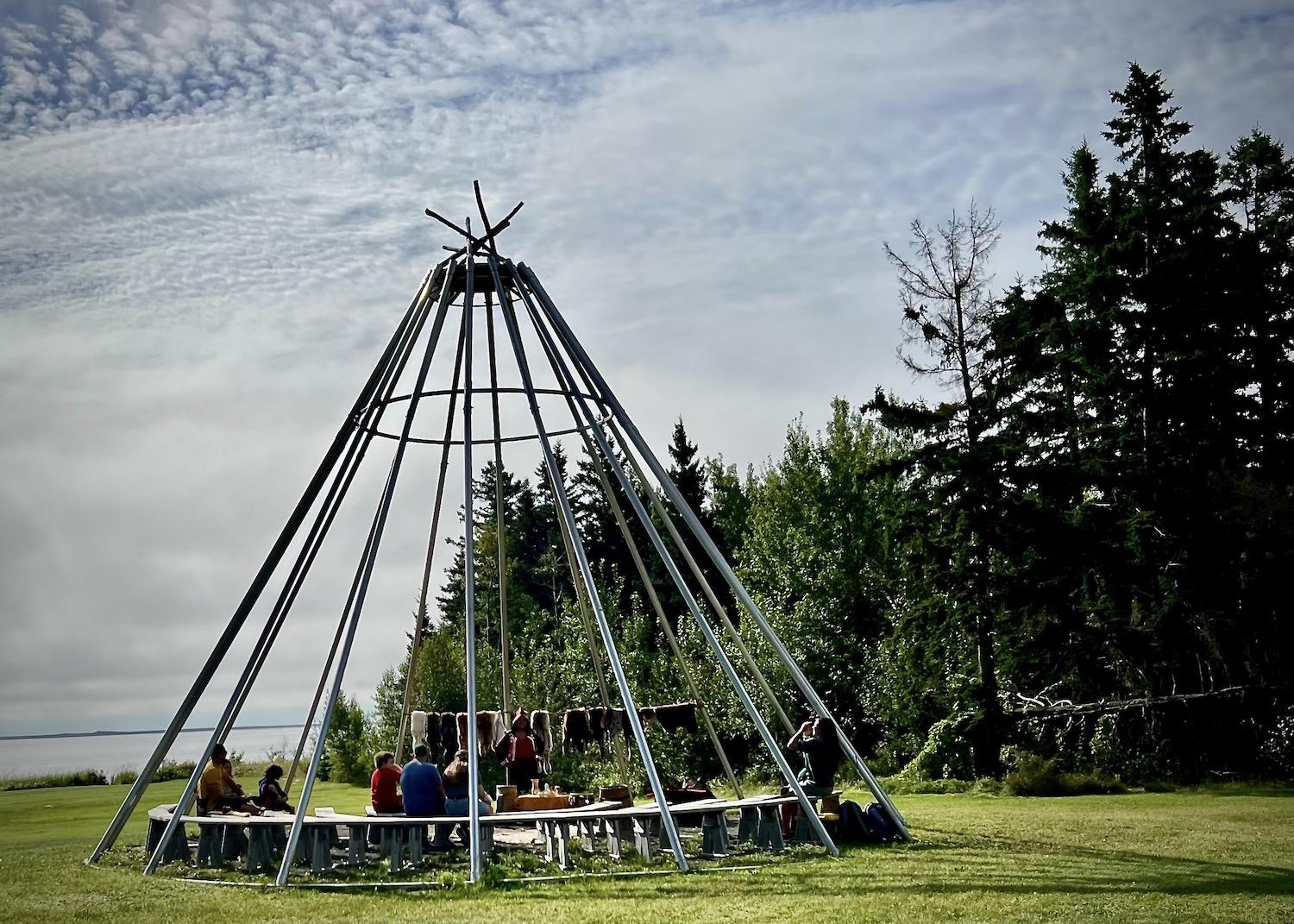 Summer visitors take part in Indigenous programming at Kouchibouguac National Park in New Brunswick.