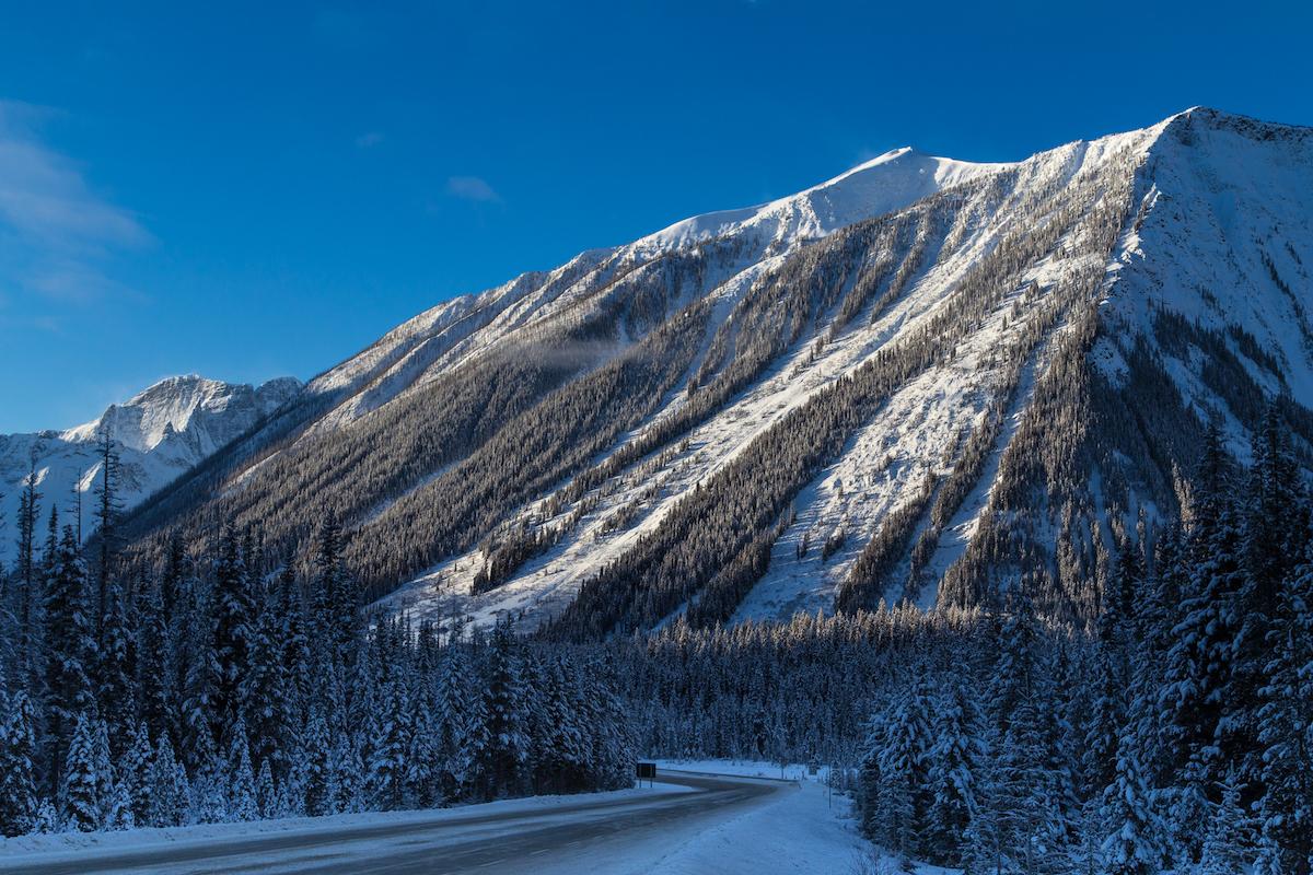 Driving through Kootenay National Park in winter.