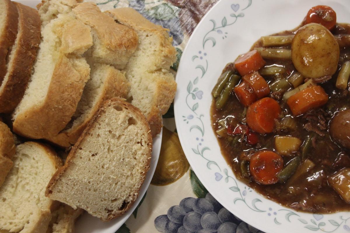 Homemade stew and bread at the end of a canoe-making workshop.