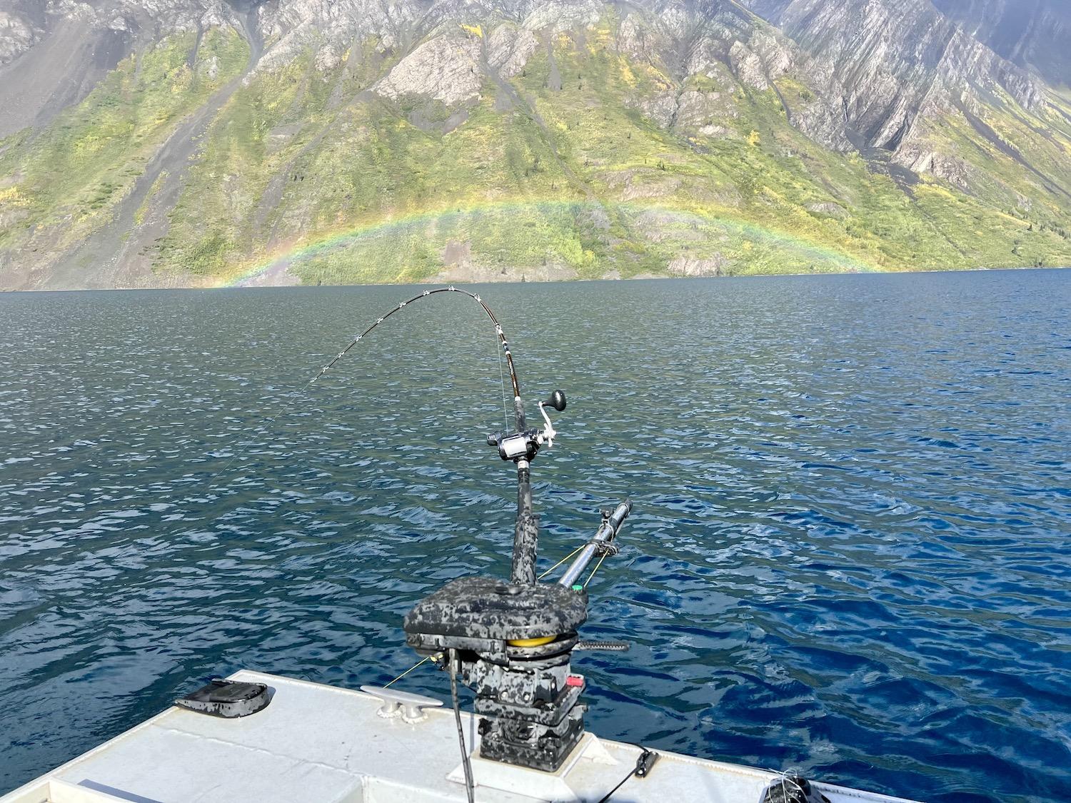 A tiny, perfect rainbow appears to plunge into Kathleen Lake (Mät’àtäna Män) in Kluane National Park and Reserve in the Yukon.