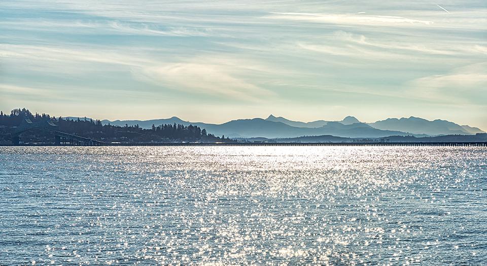 A late-afternoon view of the Astoria-Megler Bridge and the mountains in Oregon, Louis and Clark National Historic Trail / Rebecca Latson