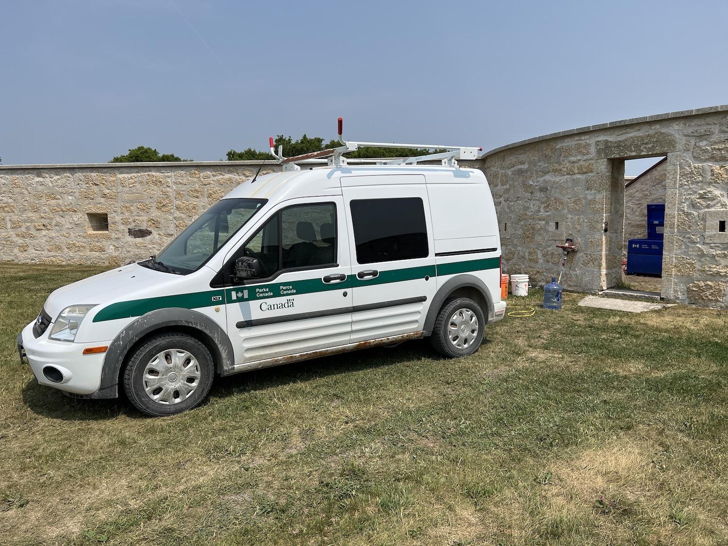 Parks Canada crews work on one of Lower Fort Garry's stone bastions.