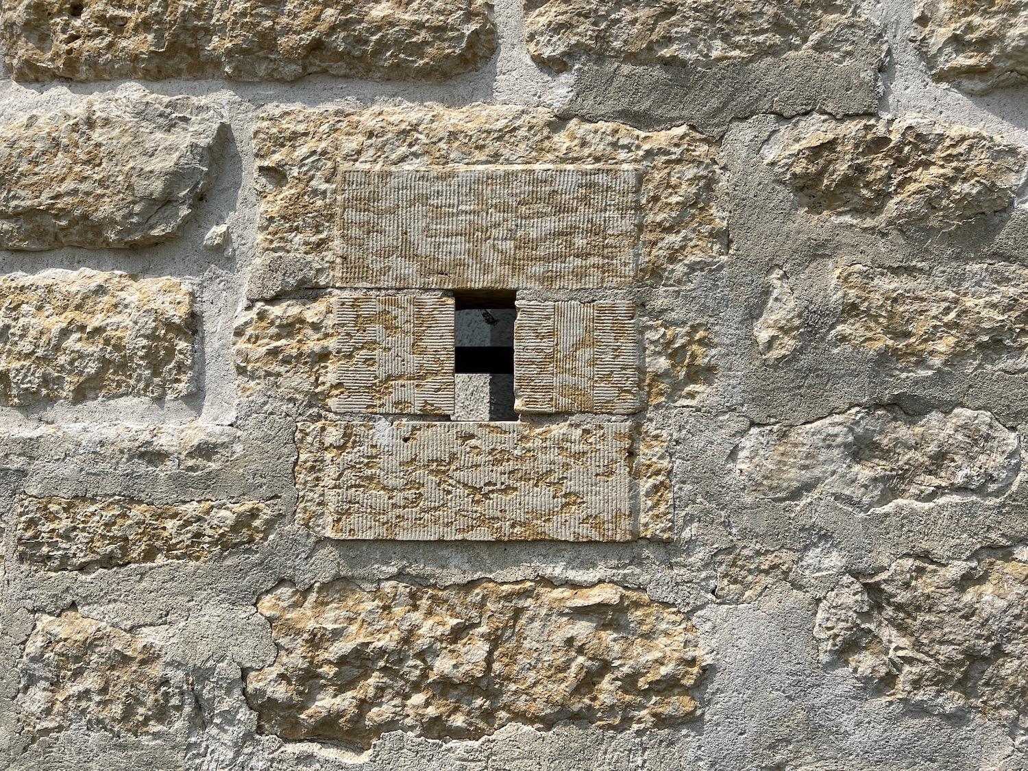 Look for fossils in the mottled Tyndall Stone at Lower Fort Garry National Historic Site.