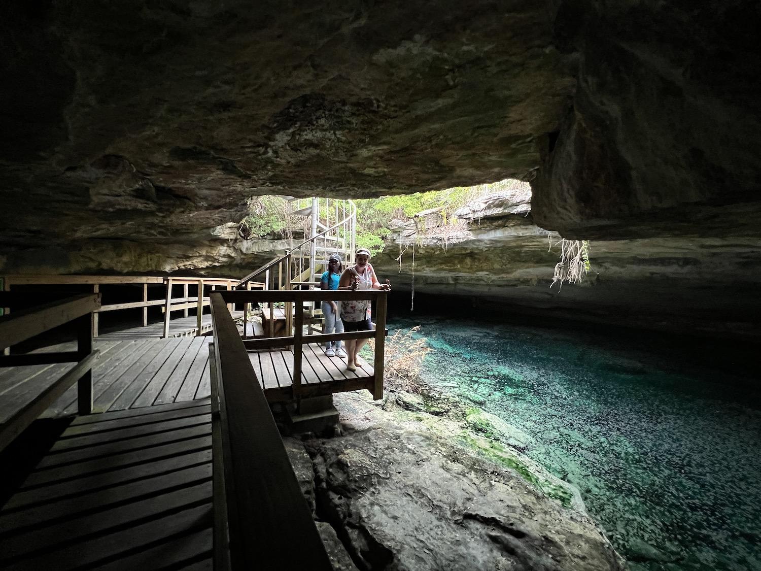 To get into Ben's Cave at Lucayan National Park, you must climb down a spiral staircase.