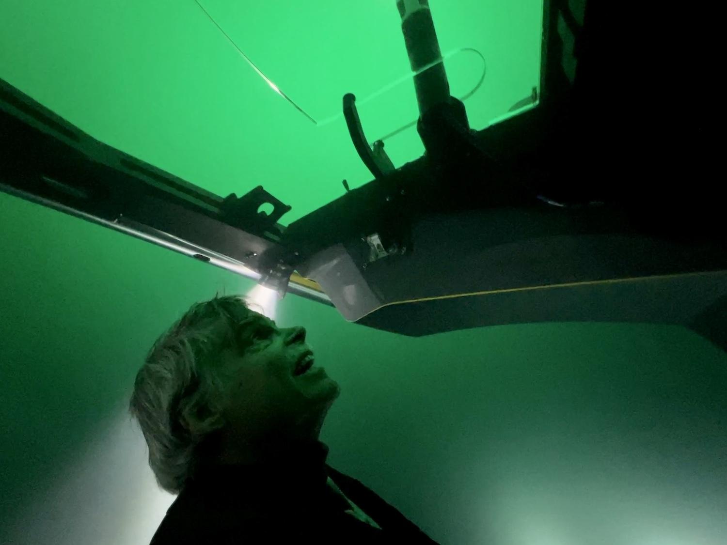 Viking guest Bob Palmer scans Lake Superior from his seat inside a six-passenger yellow submersible named John.