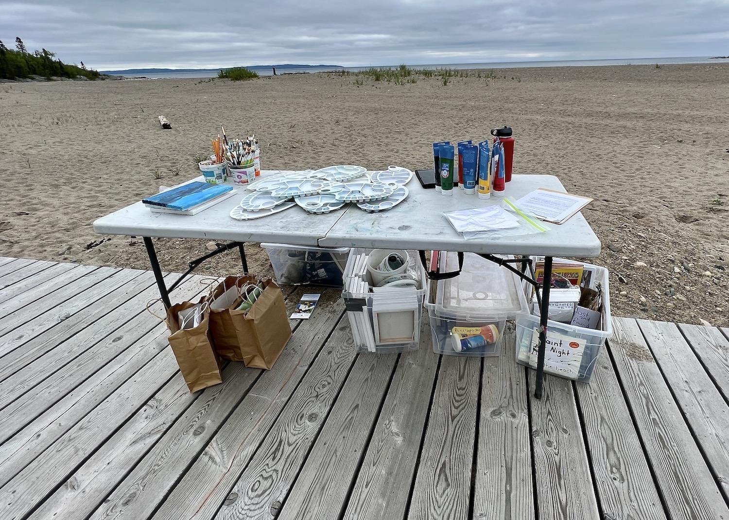 Parks Canada sets up its "Painting Superior" experience by the Terrace Bay Beach Pavilion.