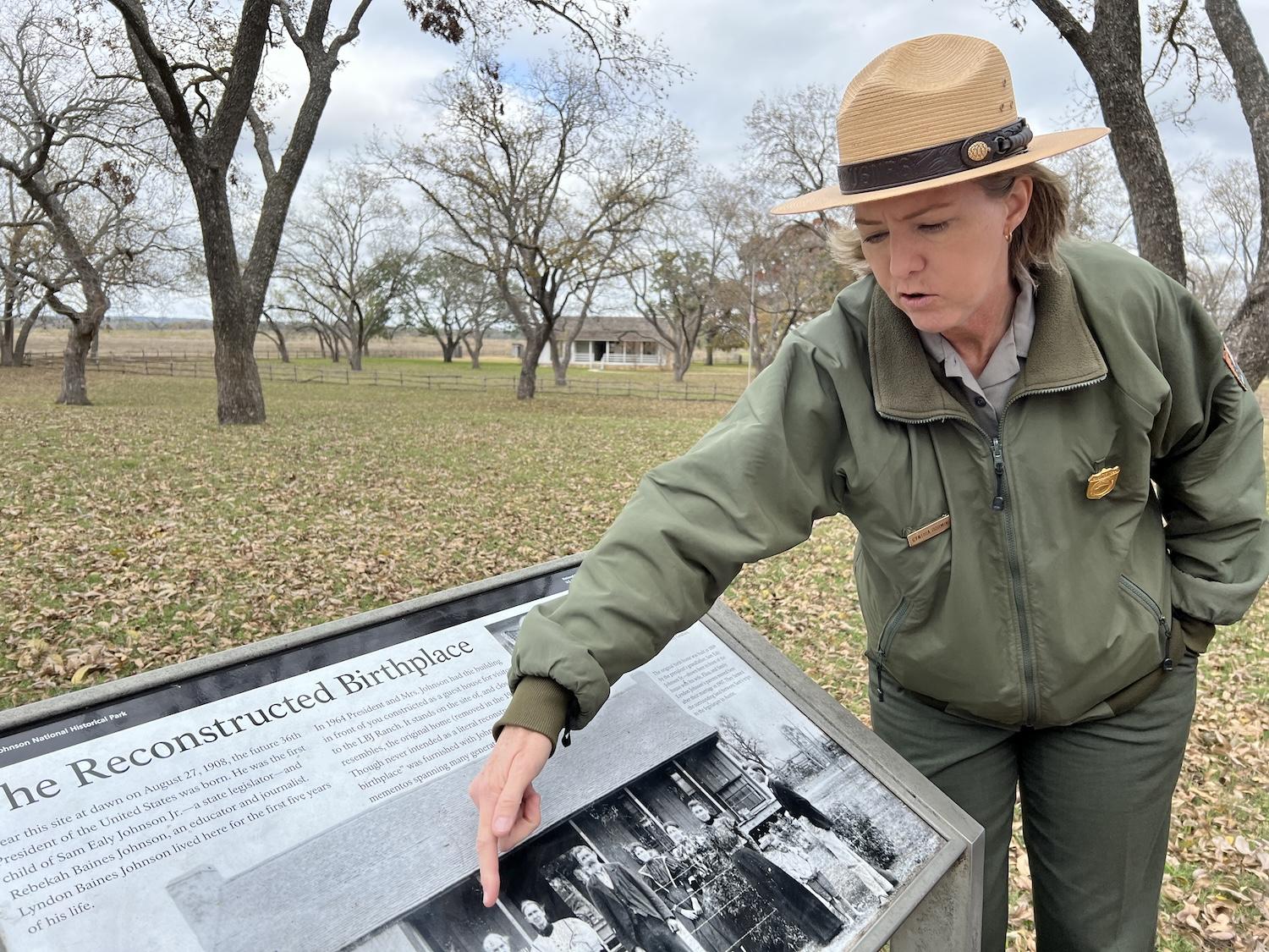Interpretive park ranger Cynthia Dorminey stands near the reconstructed birthplace of Lyndon B. Johnson along the LBJ Ranch Driving Tour.