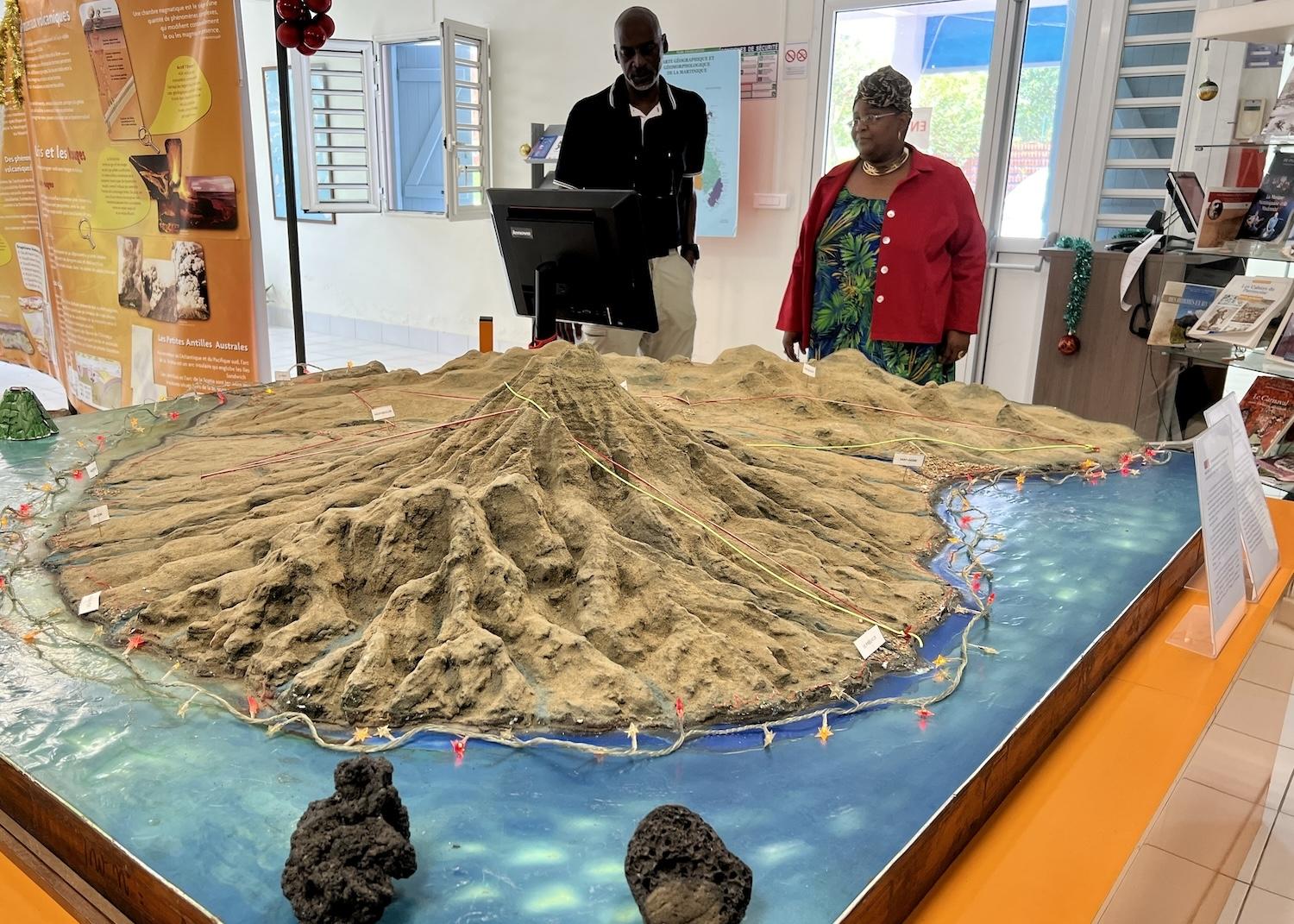 At La Maison des Volcans, hiking expert Gilles Vicrobeck speaks with the museum's Frédérique Burgo.