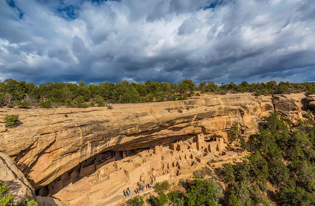 Sunlight and storm clouds over Cliff Palace, Mesa Verde National Park / Rebecca Latson