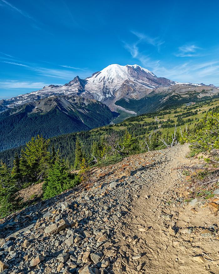 Park road, parking area beyond, and "The Mountain" views from Dege Peak trail, Sunrise area, Mount Rainier National Park / Rebecca Latson