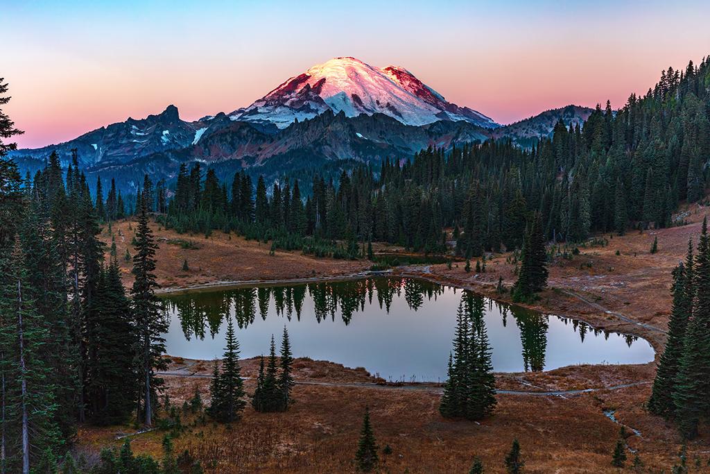 Dawn's rosy glow over Tipsoo Lake, Mount Rainier National Park / Rebecca Latson