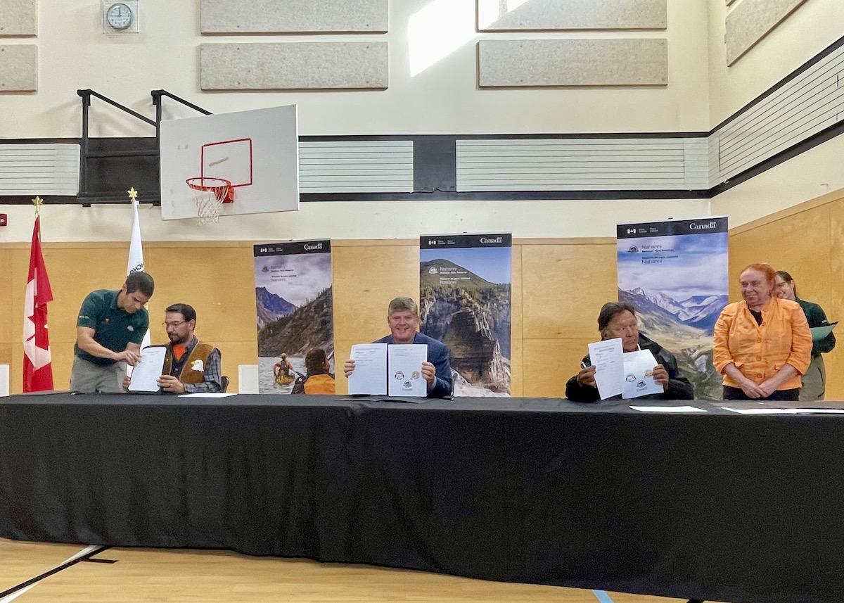 Signing the Ndahecho Gondié Gháádé Agreement are (from left to right): Chief Steve Vital of the Nahʔą Dehé Dene Band, Parks Canada President/CEO Ron Hallman and Grand Chief Herb Norwegian of the Dehcho First Nations.  