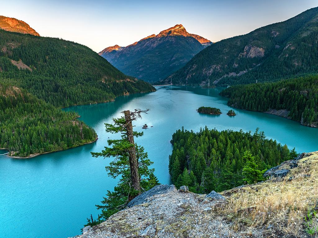 Sunrise-tipped mountain tops at the Diablo Lake Overlook, Ross Lake National Recreation Area, North Cascades Complex / Rebecca Latson