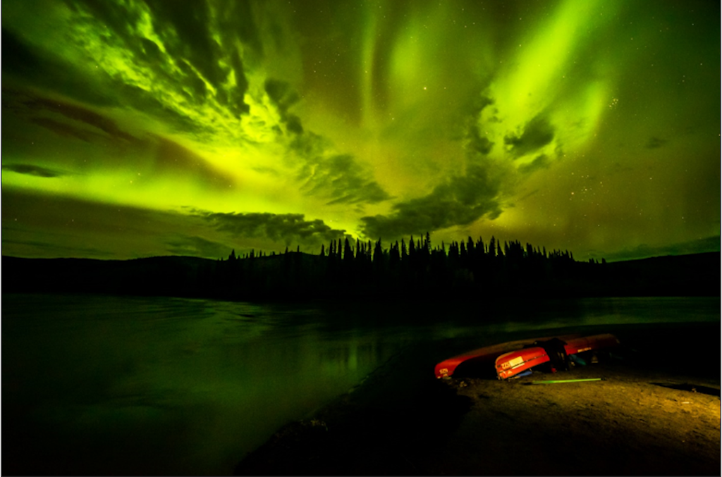 The northern lights are shown over the confluence of the Peel River and Snake River in the Peel Watershed in the Yukon Territories.