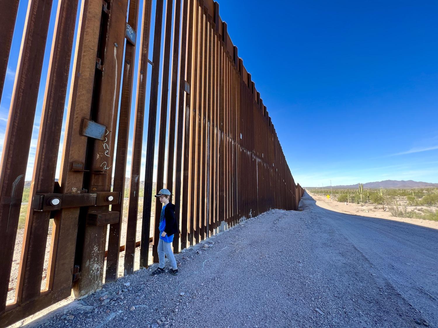 Writer Jennifer Bain's son experiences the border wall along the southern boundary of Organ Pipe Cactus National Monument.