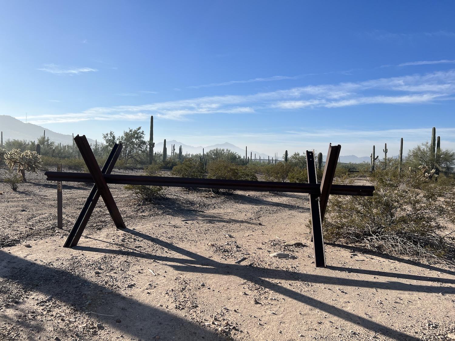 Some of the vehicle barriers that once marked the border with Mexico can still be found along South Puerto Blanco Drive.