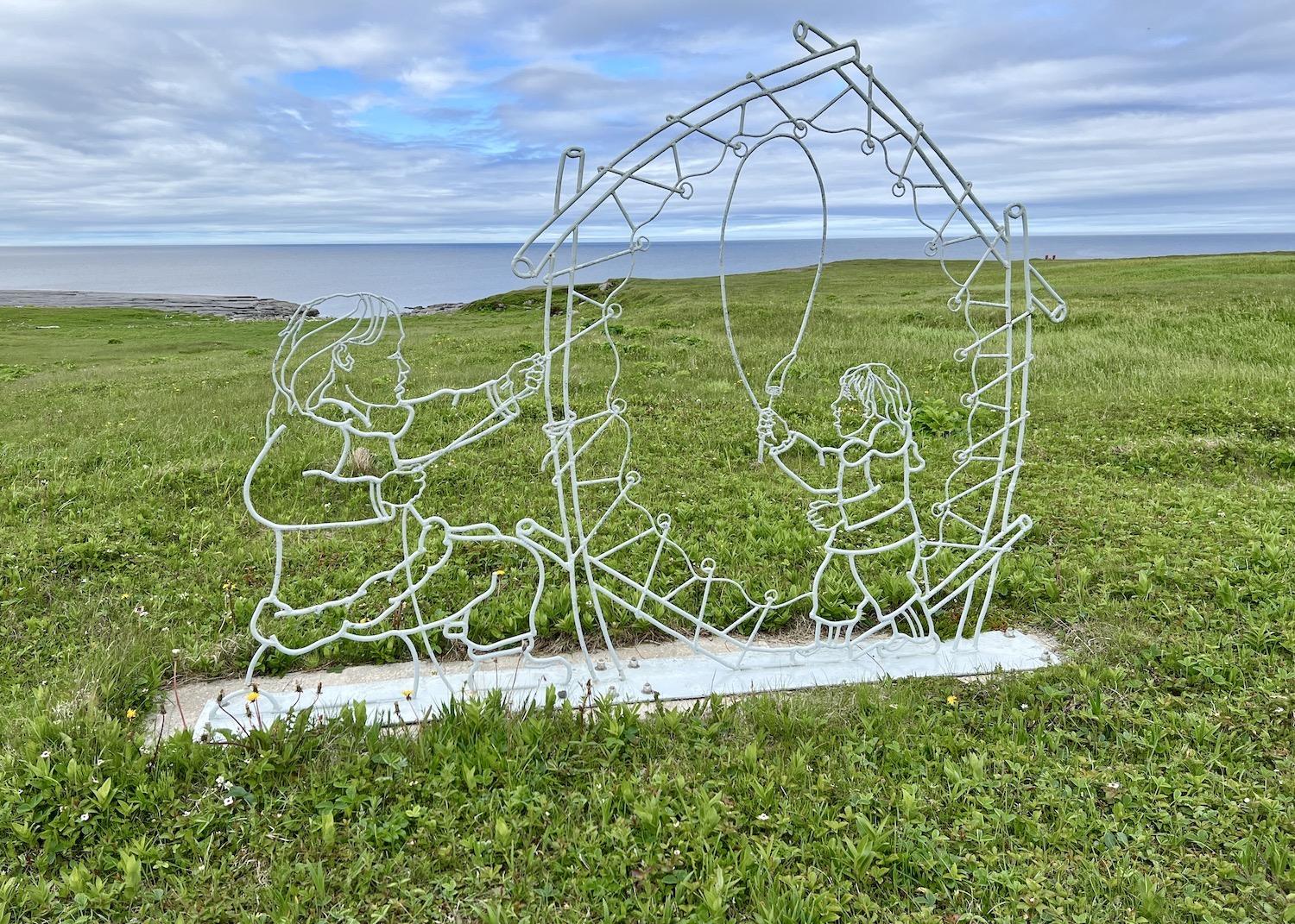 Near Point Riche Lighthouse at Port au Choix National Historic Site, this steel "Mother and Son" sculpture by Jim Maunder and Michael Massie commemorates Indigenous settlement in the area.