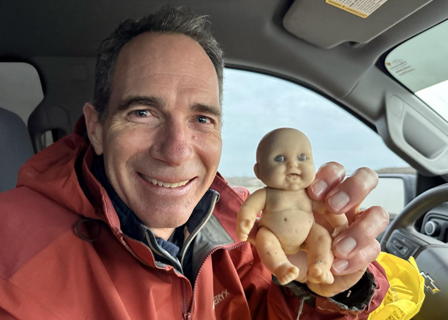 Jace Tunnell shows off one the "creepy dolls" he found on Padre Island's beaches.
