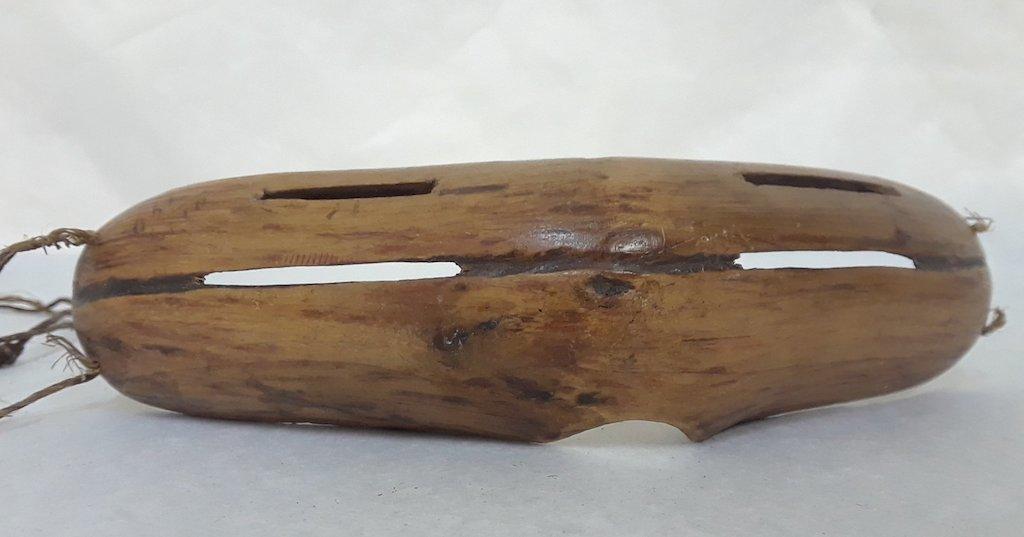 Hand-carved wood snow googles made by Inuit.