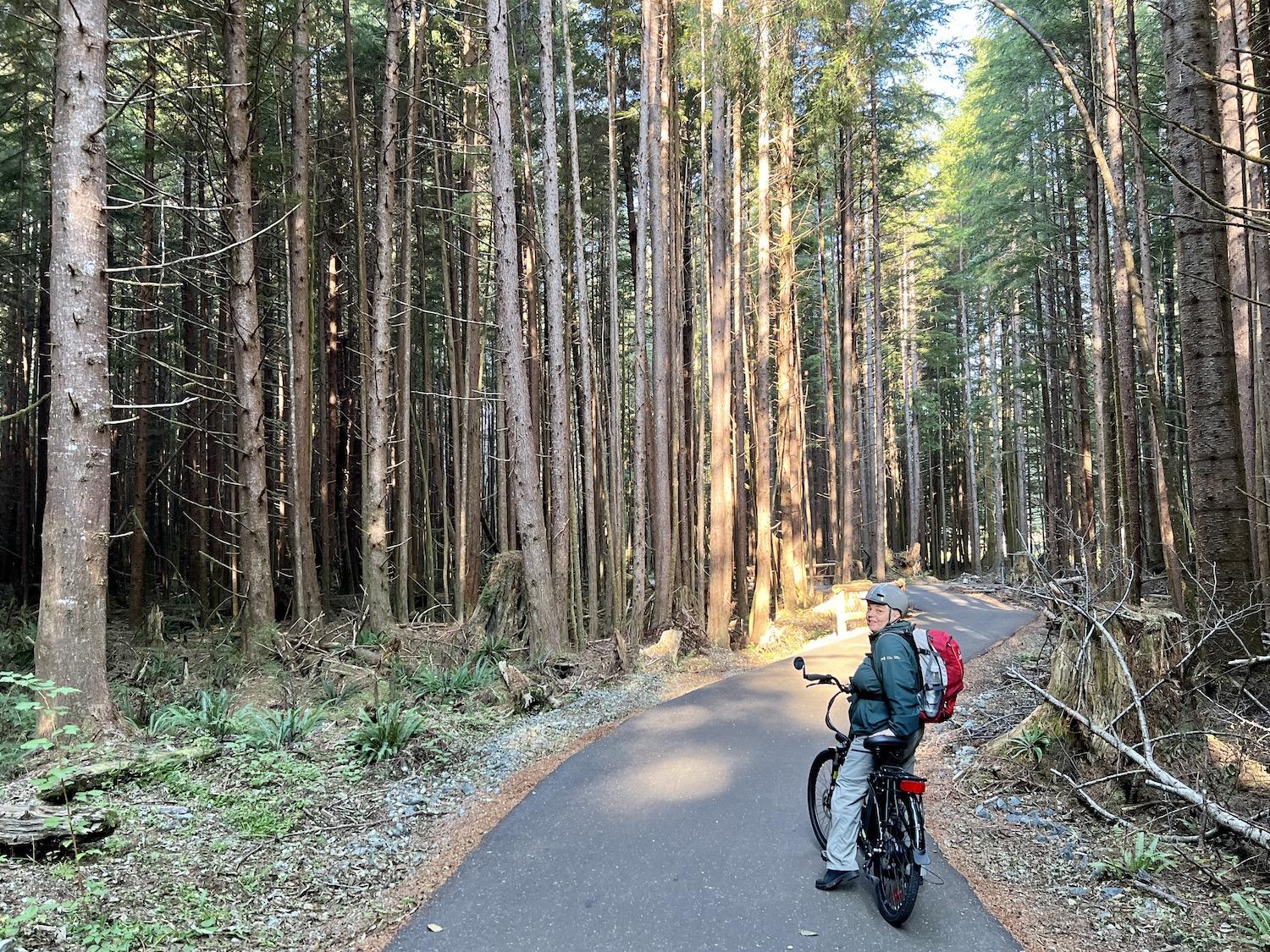 Parks Canada's Crystal Bolduc e-bikes the new multi-use pathway in Pacific Rim National Park Reserve's Long Beach Unit.