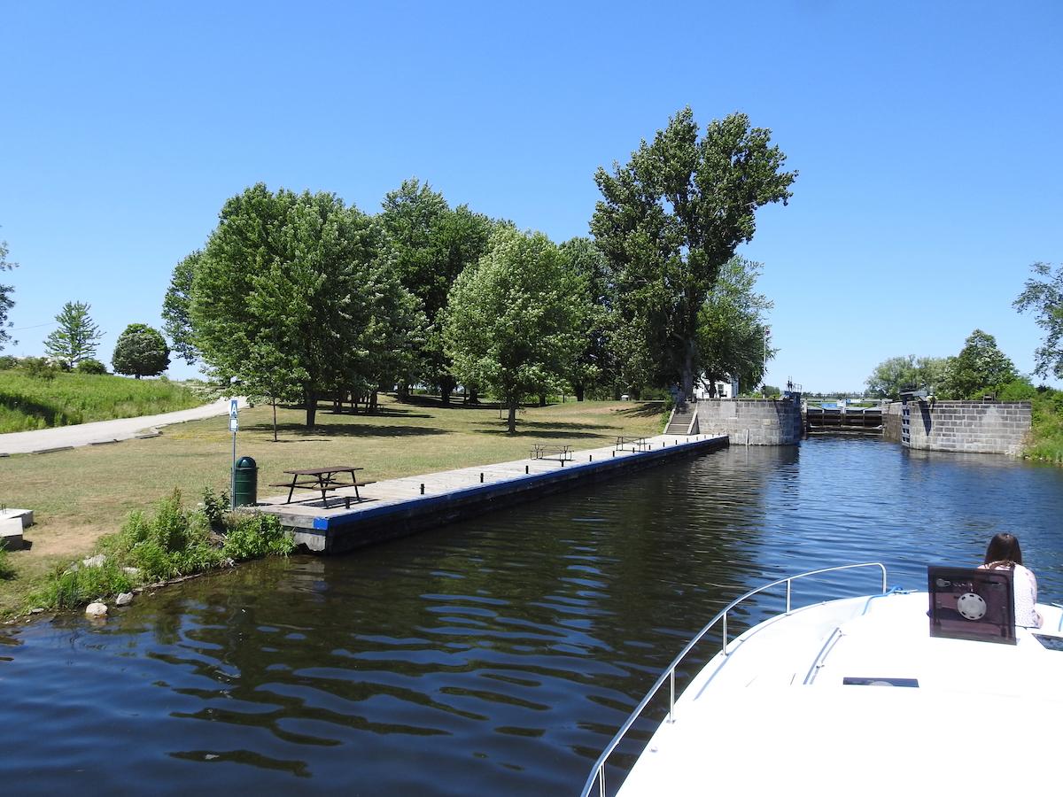 Approaching a lock on the Rideau Canal with a Le Boat houseboat rental.