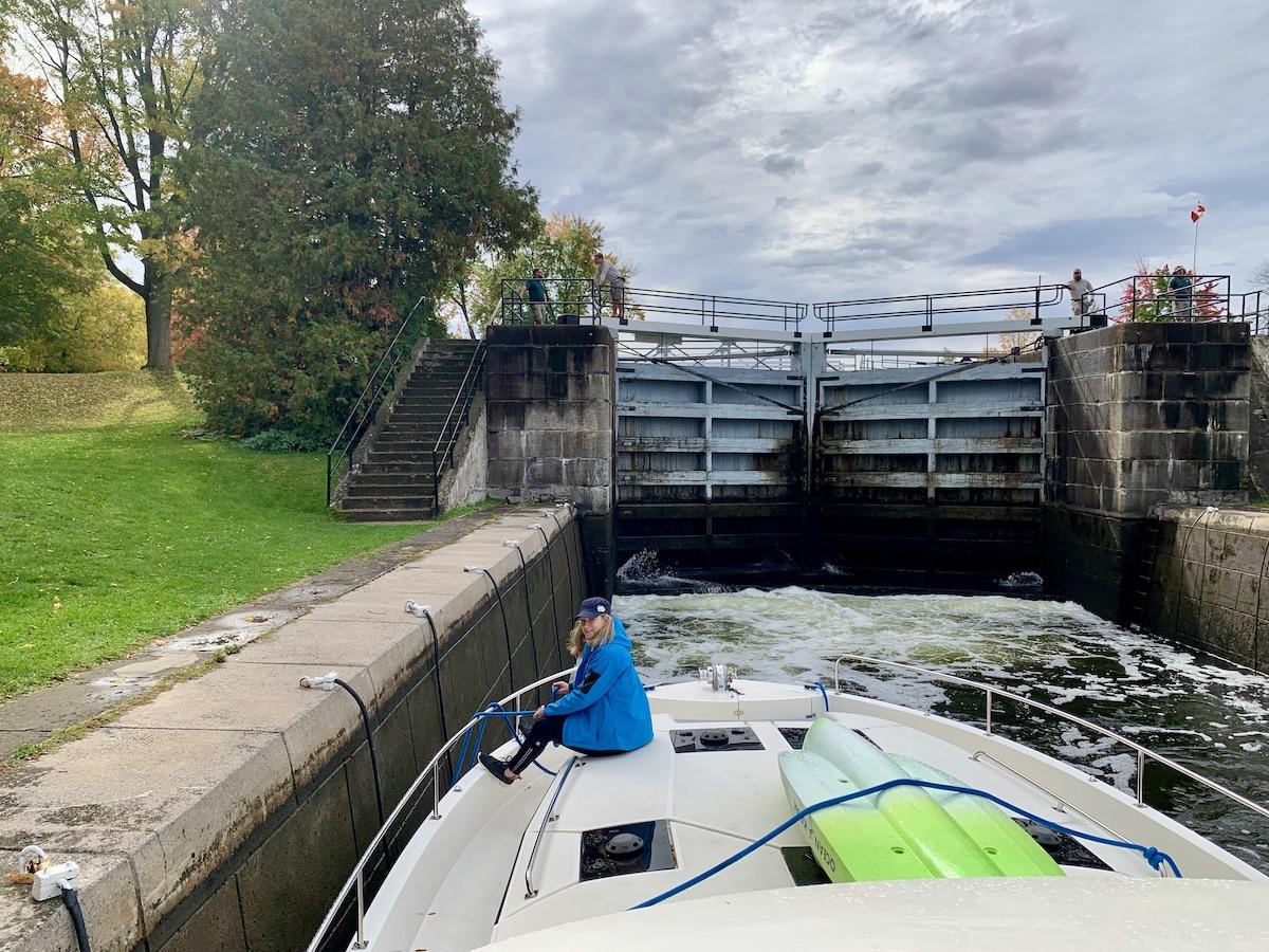 Boating through a lock on the Rideau Canal National Historic Site.