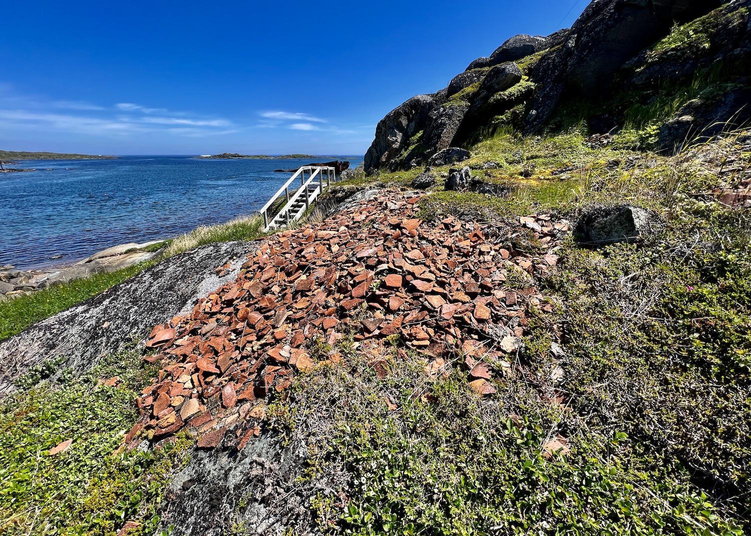 Fragments of European roofing tiles from the Basque whaling area can still be found on Saddle Island, part of the Red Bay National Historic Site.
