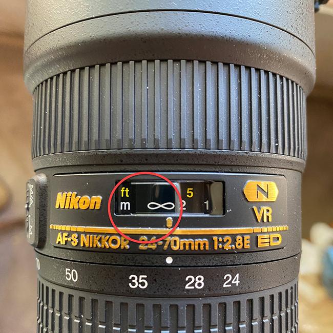 Where the focus ring mark falls on infinity on one of my Nikon lenses / Rebecca Latson