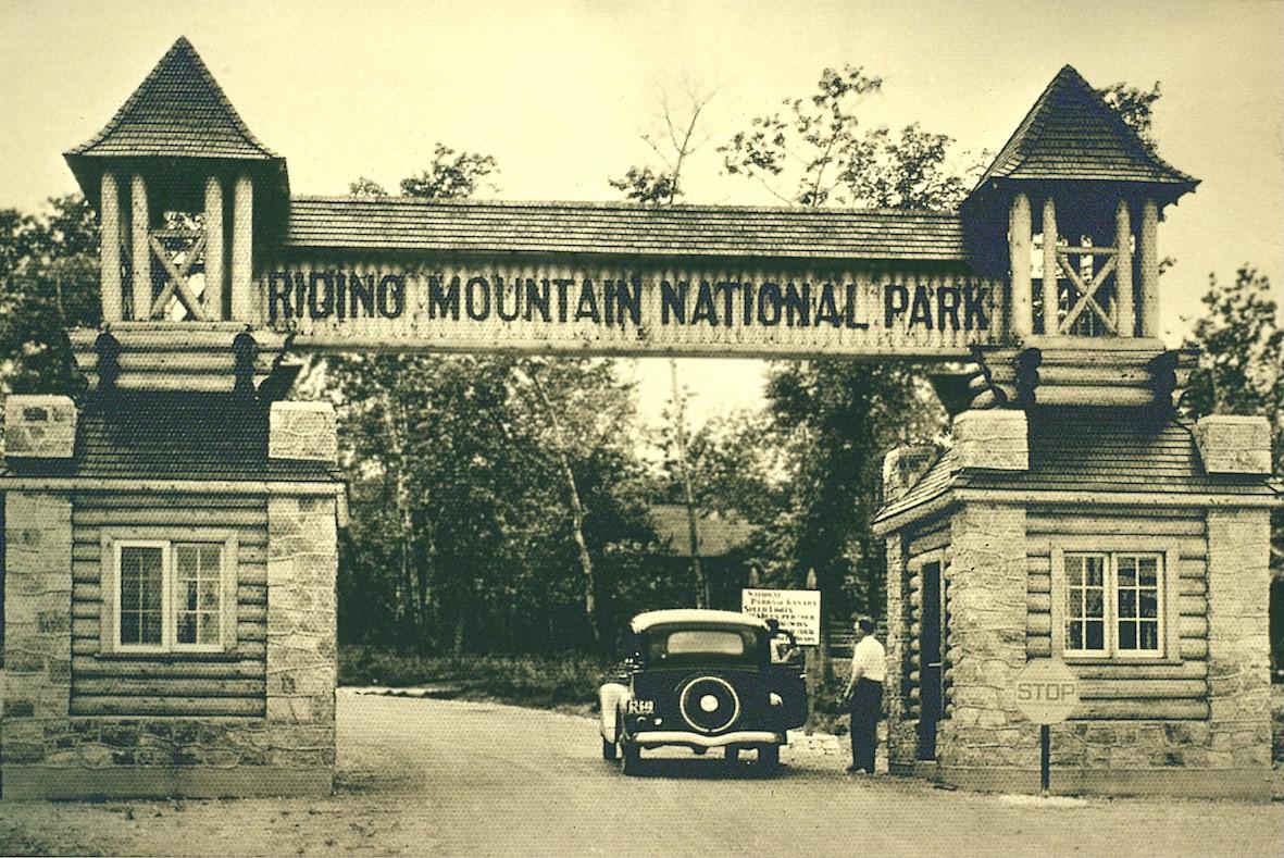 An archival shot of the historic East Gate to Riding Mountain National Park.