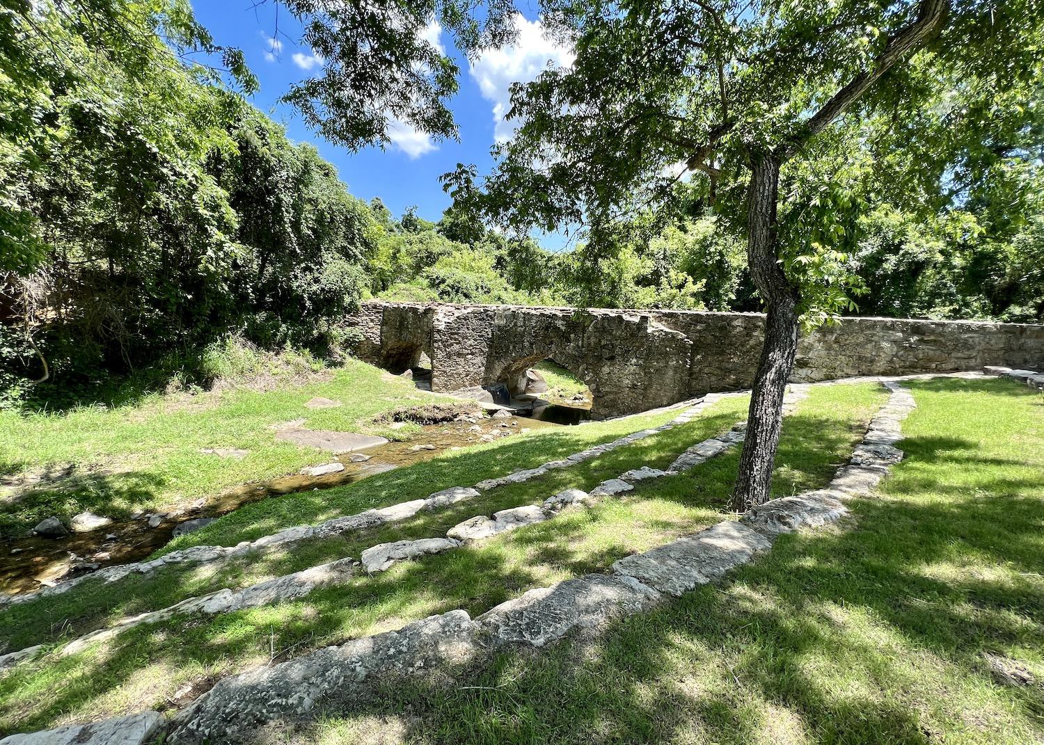 The Espada Aqueduct is a National Historic Landmark that goes over a creek and was recently drained to clear sediment.