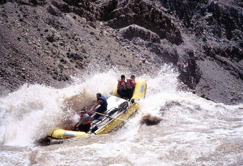 Raft in Cataract Canyon navigating white water rapids in the Colorado River at Canyonlands National Park / NPS