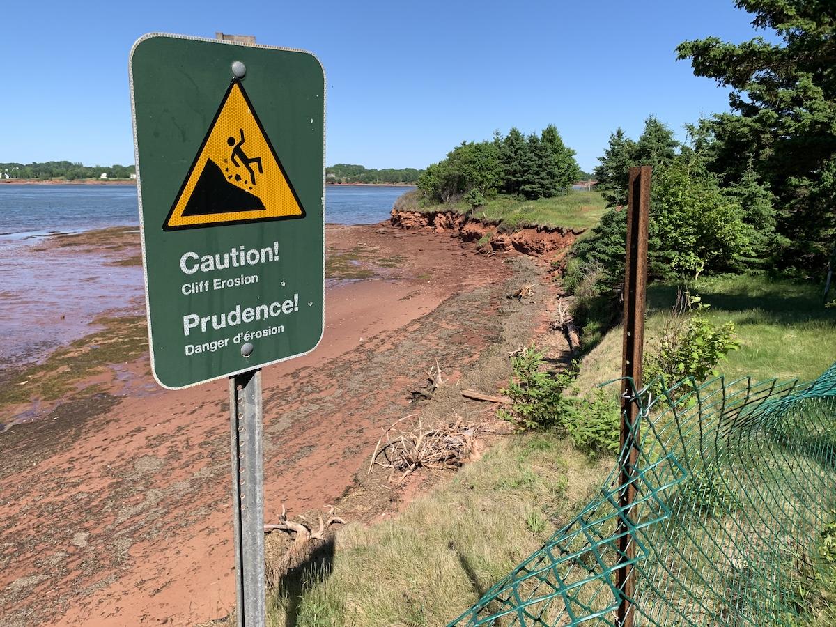 Cliff erosion, accelerated by climate change, is an issue at Skmaqn. Locals use an unofficial path for beach access.