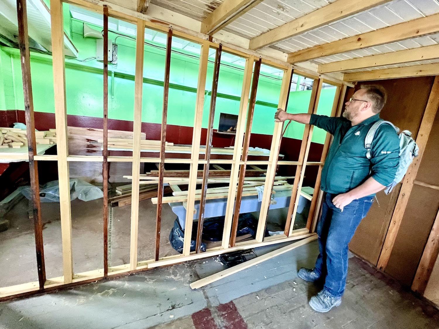 Inside the S.S. Klondike, shipwright Terry Karlsen shows work he's doing to fix two staterooms.