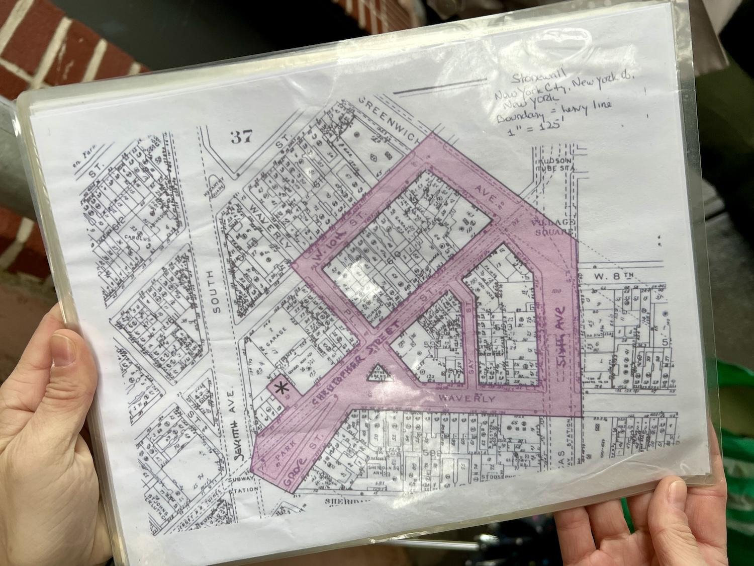 Stonewall National Monument lead ranger Julie Burna shows the laminated map she uses to show tours the area of Greenwich Village that is federally protected and can be interpreted.