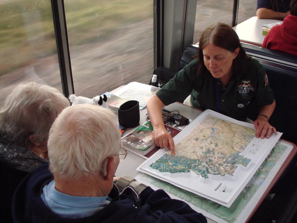 National Park Service guide Barbara Bond-Howard helps passengers plan hiking trips in Glacier National Park.