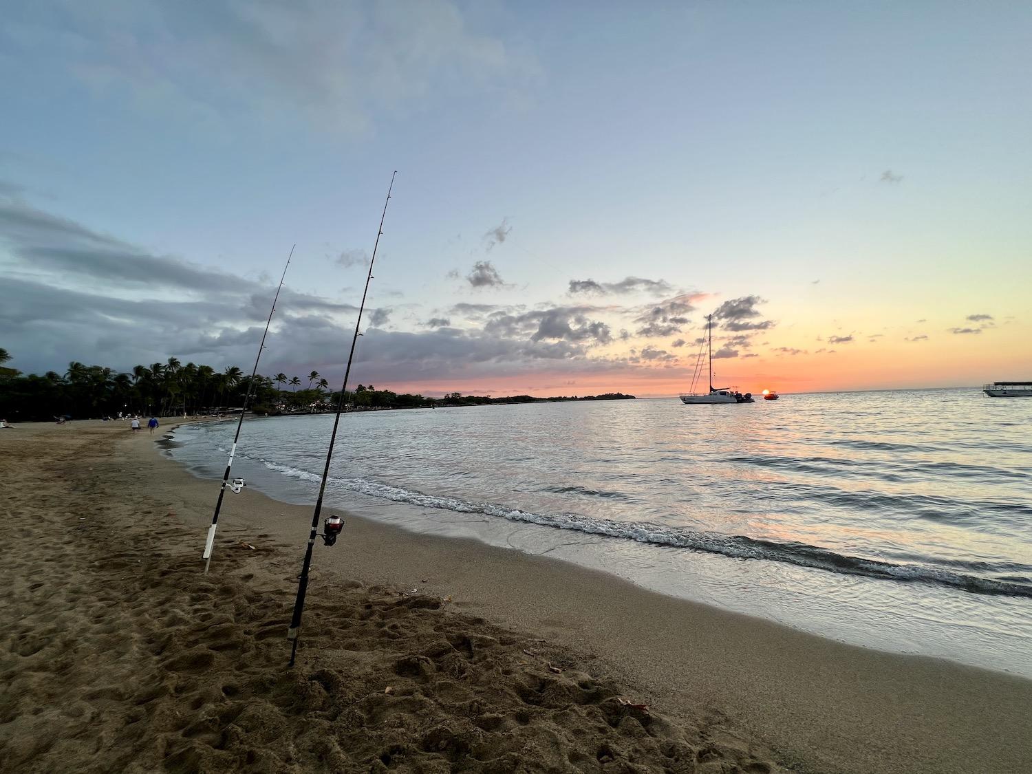 FFishing at sunset in ʻAnaehoʻomalu Bay by the Waikoloa Beach Marriott Resort and Spa.