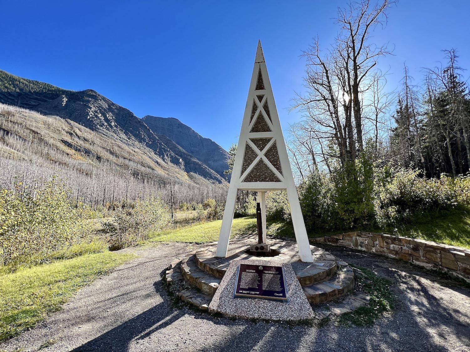 A monument shaped like an oil derrick stands at First Oil Well in Western Canada National Historic Site along the Akamina Parkway.