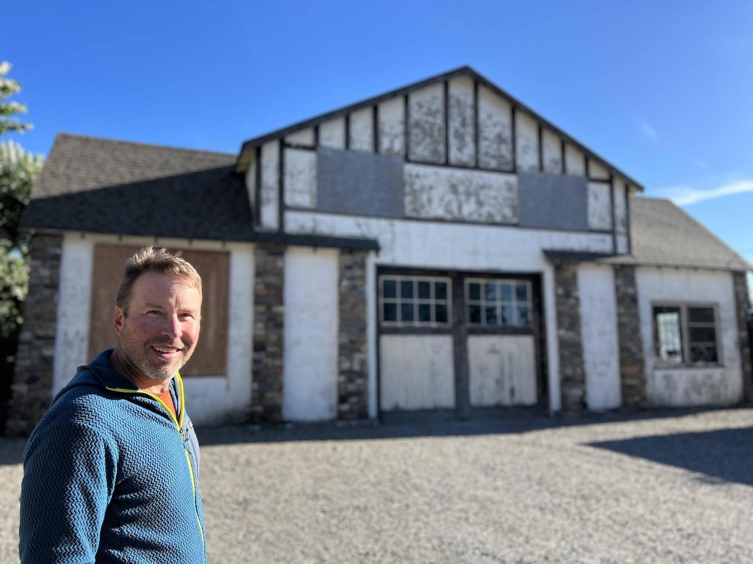 Carey Tetzlaff, lead guide with Tamarack Outdoors in Waterton Lakes National Park, stands in front of the company's garage/warehouse that famously appeared in the TV series, The Last of Us.