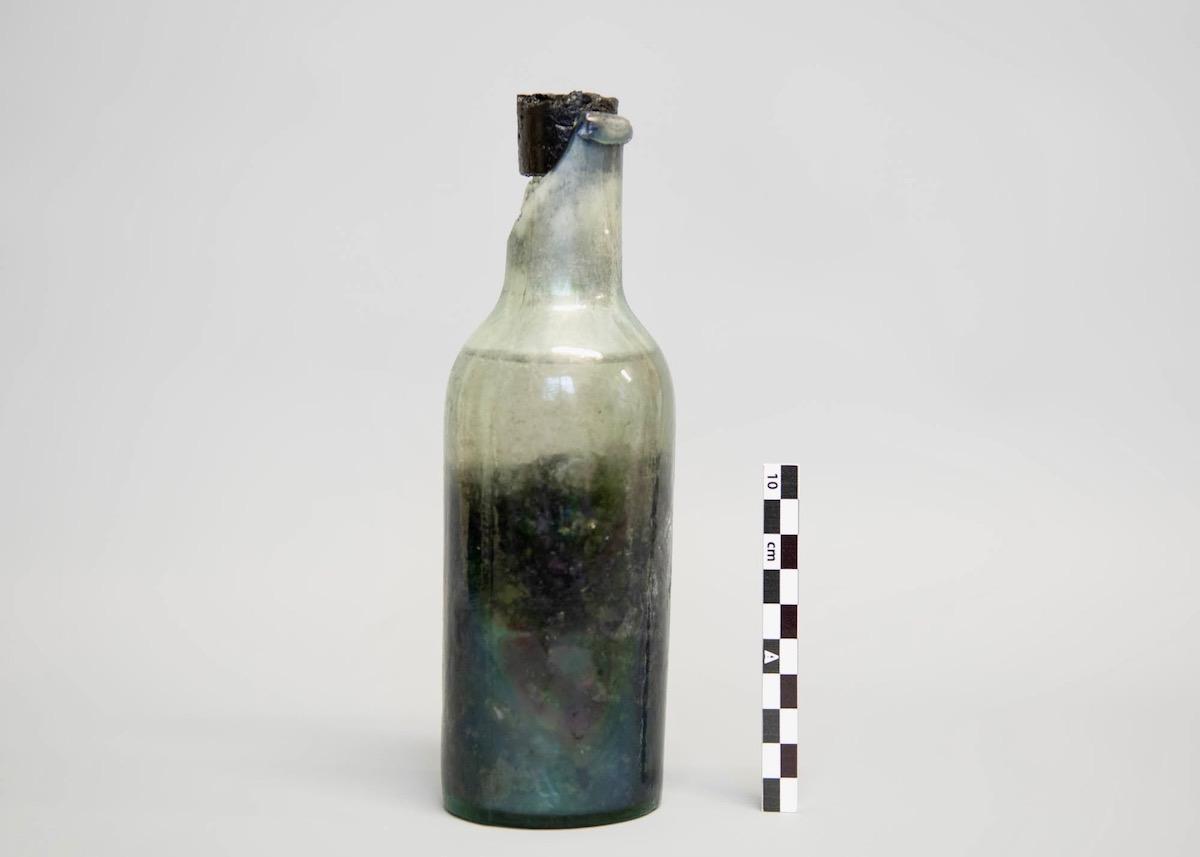 A bottle filled with an unidentified food condiment that was recovered from HMS Erebus is shown in September 2022.