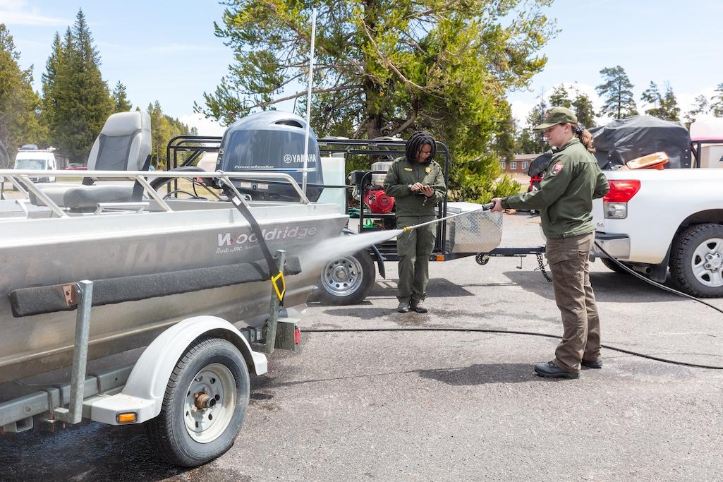 AIS technicians decontaminating a motorized boat and trailer NPS / Jacob W. Frank