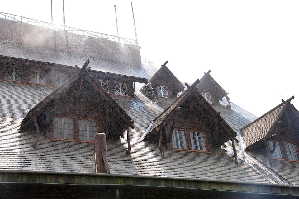 Sprinklers on the roof of the Old Faithful Inn were tested just in case they were needed/NPS