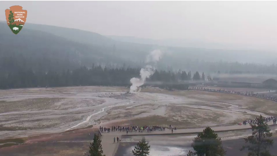 A wildfire several miles south of Old Faithful was sending smoke over the area Monday/NPS webcam A wildfire several miles south of Old Faithful was sending smoke over the area Monday/NPS webcam