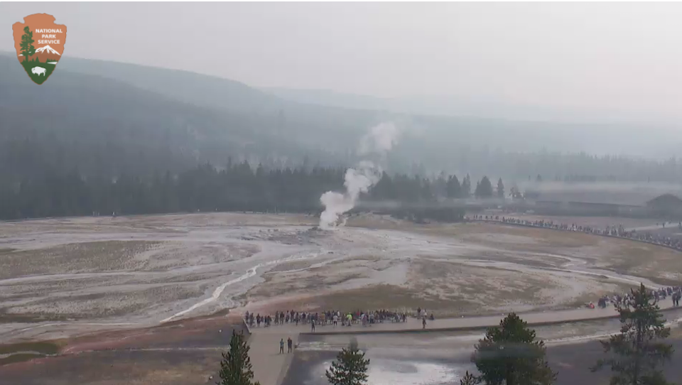 A wildfire several miles south of Old Faithful was sending smoke over the area Monday/NPS webcam
