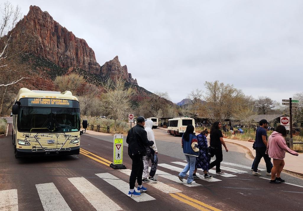 Hikers use a crosswalk in the South Entrance Area of Zion National Park. Zion proposes to replace this crosswalk with a trail connection for hikers and bicyclists away from roads as well as make other improvements. NPS Image / Jonathan Shafer