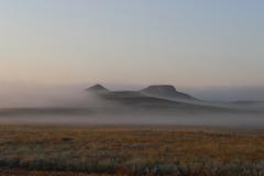 Two distant hills shrouded in fog, Agate Fossil Beds National Monument