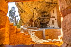A view of a part of Balcony House framed by one of the cliff dwelling's windows at Mesa Verde National Park in Colorado 