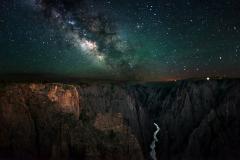 A dark sky with a bright Milky Way over the Black Canyon of the Gunnison National Park