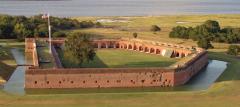 An aerial view of the pentagon-shaped Fort Pulaski surrounded by a moat, Fort Pulaski National Monument