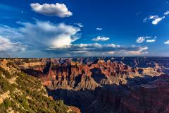Summer monsoon rain clouds and smoke from forest fires along the North Rim of Grand Canyon National Park, Arizona