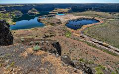 A wide-angle view of Dry Falls, a part of the Channelled Scablands created by the floodwaters of Glacial Lake Missoula, Ice Age Floods National Geologic Trail
